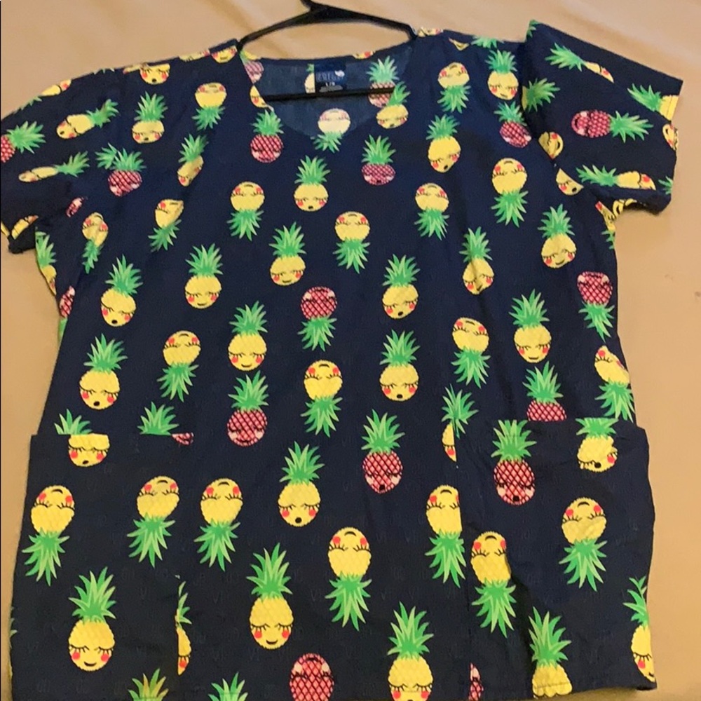 Scrub top with pineapples on it size L